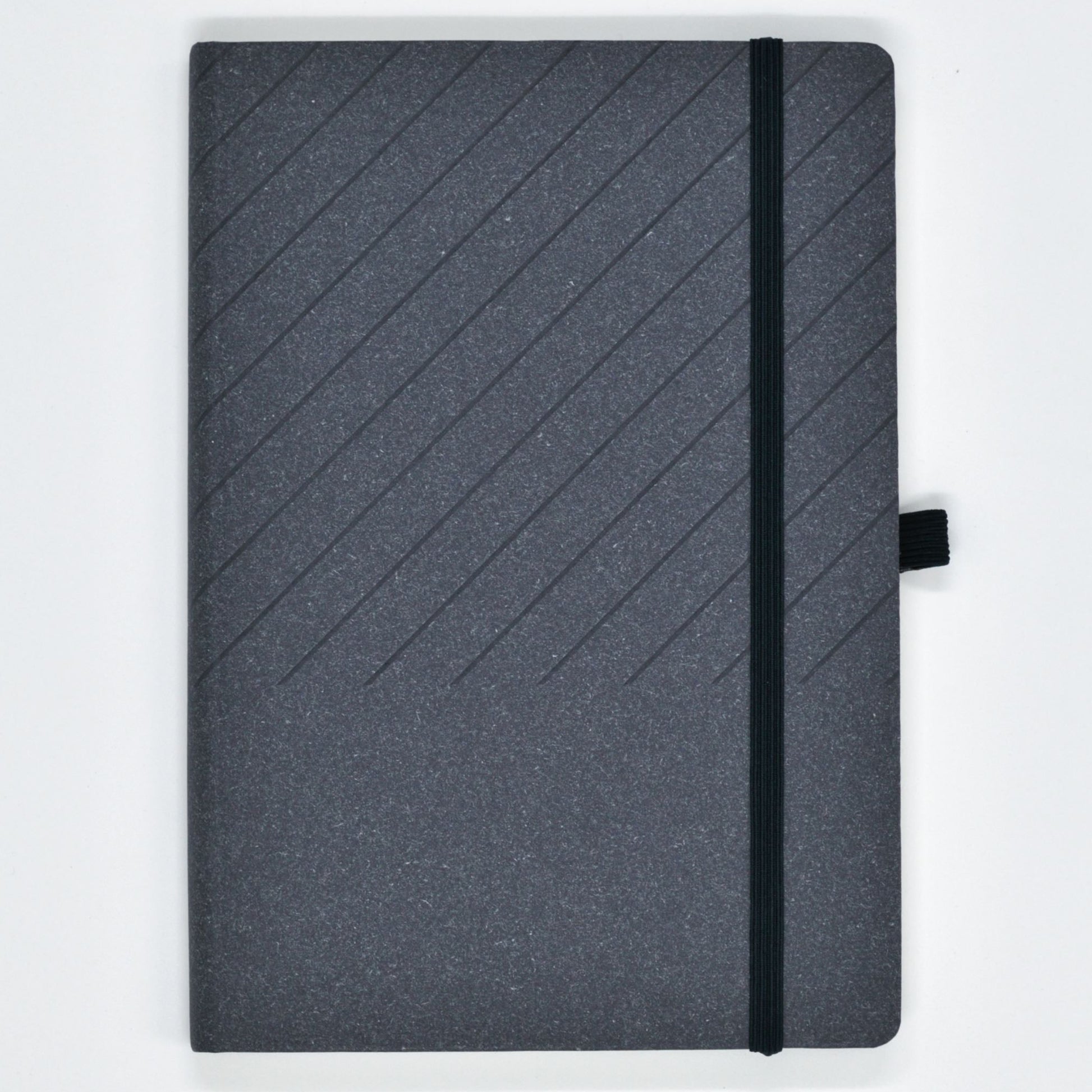 Gray notebook with a black strap on a light gray background