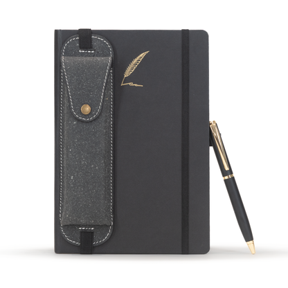 Black notebook with a pen holder and gold feather design on a white background