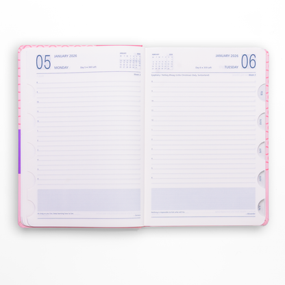 Open daily planner with calendar and notes section on a white background