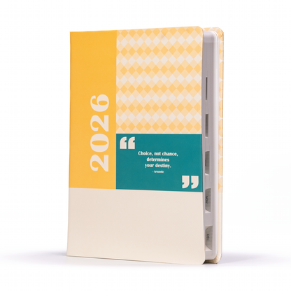 Notebook with yellow cover displaying '2026' and a motivational quote on a white background